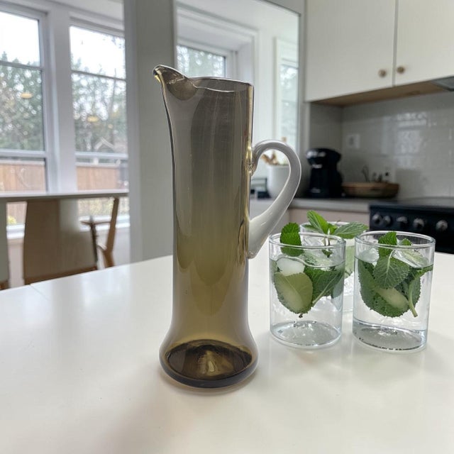 A mid-century hand-blown glass pitcher produced by Bischoff Glass Company, identified as catalog form #719 and documented...