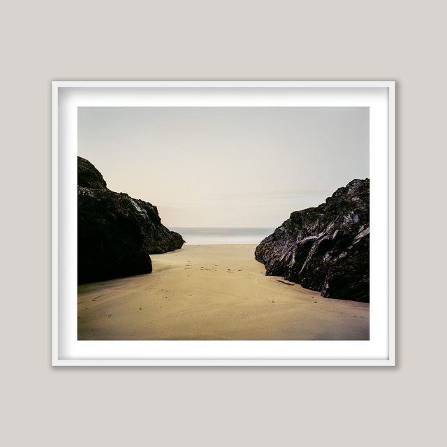 A serene early-morning photograph of Kynance Cove on Cornwall’s rugged Lizard Peninsula, at the far southwestern tip of...