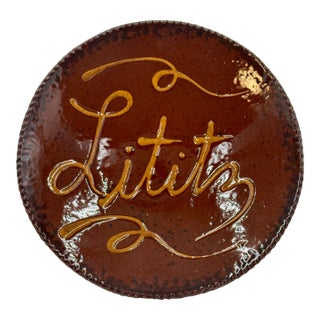 Ned Foltz 1996 Signed Redware Town of Lititz, Pa Plate With Ruddy Glaze, Darkened Saw Tooth Edges & Slip Decoration For Sale