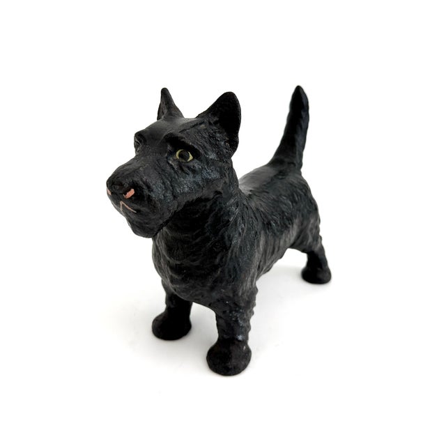 These vintage cast iron Scottish Terrier dog doorstops with heavily textured finish were primarily produced by Hubley...