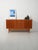 Scandinavian sideboard from the 1950s featuring a refined symmetrical composition, with central drawers and contrasting...