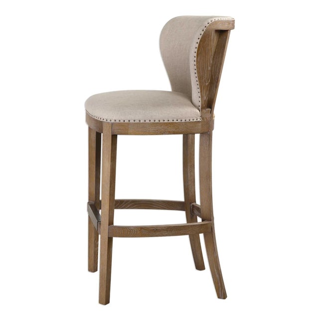 Tightly tailored in a soft, neutral linen to enhance the deconstructed style. Individually hammered upholsterers tacks can...