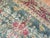 A late 19th century Persian Kerman with a matching repetitive floral design with animal figures on a green ground...