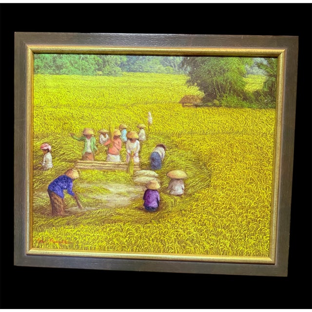 A finely crafted oil painting on canvas depicting a group of Vietnamese workers during the rice harvest. In a vast,...