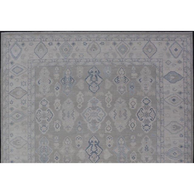 Turkish Oushak Rug With Soft Gray Field and Pale Blue Geometric Motifs For Sale - Image 4 of 16