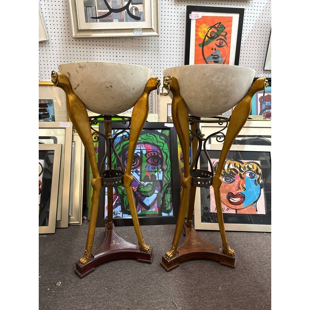 Fantastic pair of Italian Leather and Wood Gold Guilded Floor Planters. Each have lions heads on the top and hoof feet on...