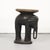 Unique African side table, primitive and rough, carved from a single piece of wood in the shape of an elephant. The object...