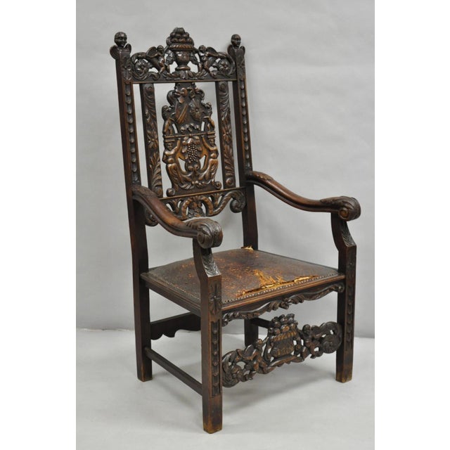 Antique Italian Renaissance Carved Walnut Throne Arm Chair w/ Winged Cherubs and Floral Embossed Leather Seat. Circa Late...