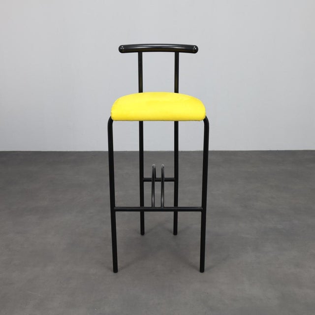 A striking set of four postmodern barstools from 1980s italy. The minimalist black metal frames are complemented by newly...