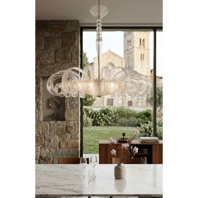 A rare 1940s masterpiece by Barovier & Toso, this exquisite Murano chandelier showcases the iconic 'pulegoso' glass...