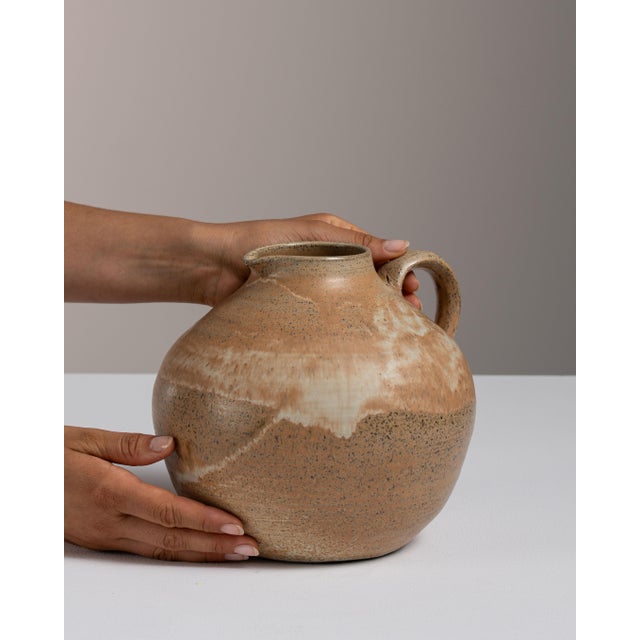 This 1960s jar from Denmark is finished in tan, worked in ceramic. Its form follows honest, well-proportioned lines...