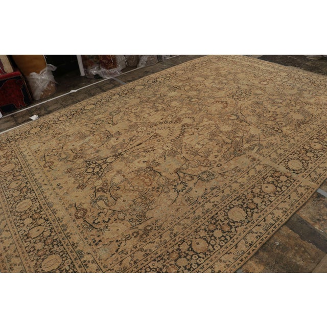 Hand-knotted in wool, an antique 10x15 Doroksh Persian rug from India circa 1920-1930 - curated by Rug & Kilim. On the...