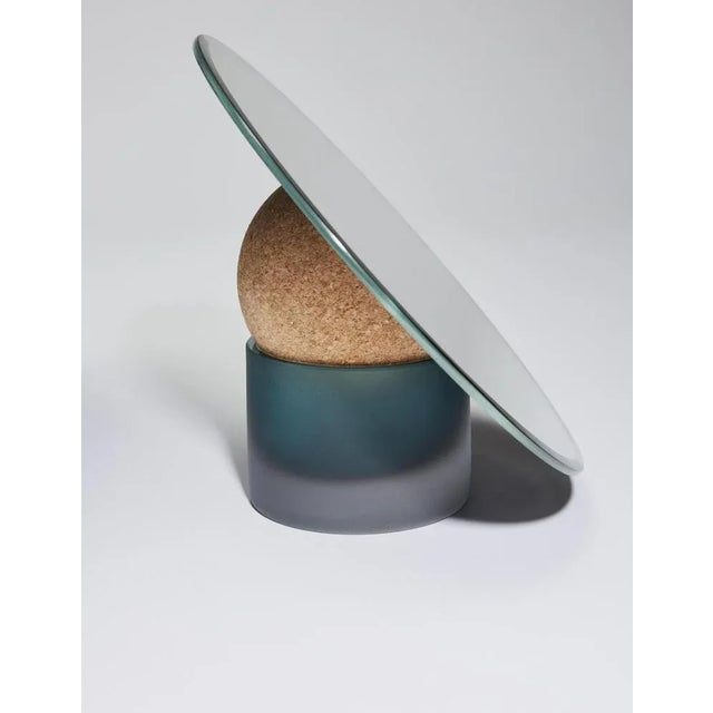 Astra table mirror-24 by Clemence Birot Dimensions: Mirror Ø 24 x 20 cm Materials: mirror, glass, cork.