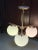 Design Plus Gallery presents a Sphere & Stem Chandelier by West Elm. Three milk glass globes, elevated with brushed brass,...
