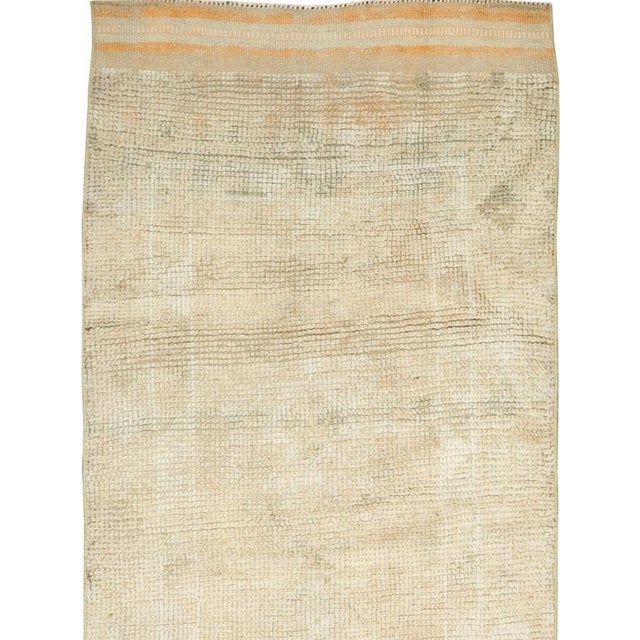 This mid-20th-century Turkish Anatolian runner presents an exceptionally restrained composition defined by a softly...