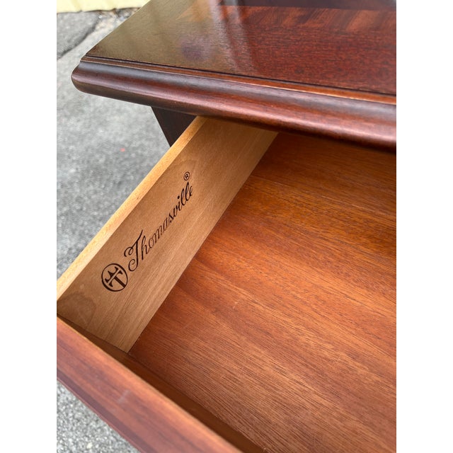 Very nice mahogany Chippendale style sofa table by Thomasville. Banded top with bookmatched flame mahogany. Two drawers...