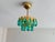 A captivating statement lighting fixture, this compact 1-light mini chandelier pairs solid polished brass with hand-...