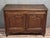 Rustic louis xv period buffet in solid oak, circa 1750, with two molded doors at the front. wooden top. cabriole legs...