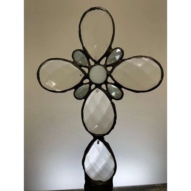 This one-of-a-kind assemblage sculpture pairs an embossed clear glass flask bottle with a handcrafted cross composed of...