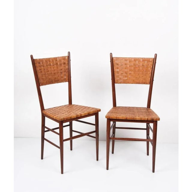 Incredible pair of Mid-Century chairs in beech. These extraordinary pieces were designed and signed by Figli di Sanguineti...