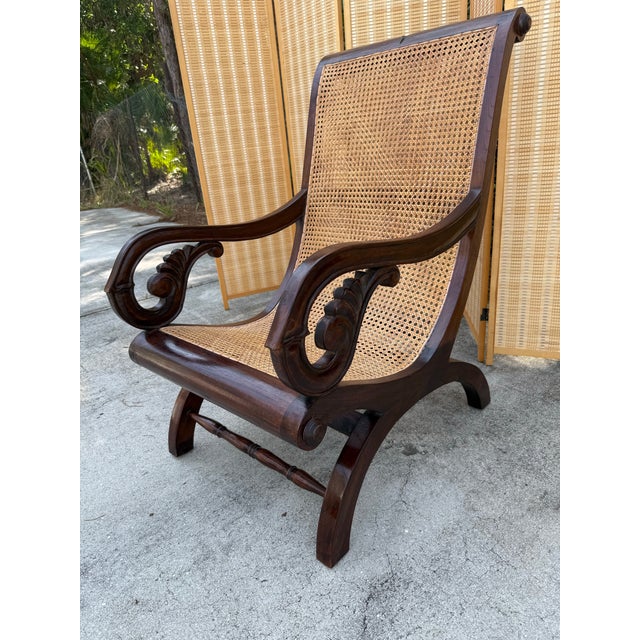 A beautifully crafted mid 20th century British Colonial planter’s chair, defined by its quiet elegance and exceptional...