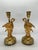 French, circa 1815. This exquisite pair of French Empire gilt bronze candlesticks, crafted circa 1815, embodies the...
