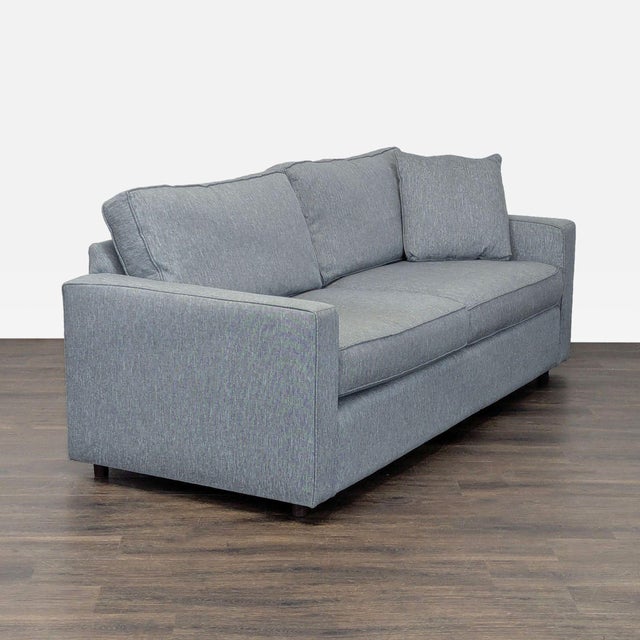 This Room & Board 3-seat sofa features a modern, clean-lined design and comes in a versatile gray fabric. Its plush seat...