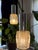 This pair of pendant lights combines textured pressed glass shades with polished chrome-plated cylindrical fittings in a...