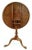 A fine American walnut 18th Century tilt top bird cage table, Philadelphia, circa 1780. The top with a molded edge over a...