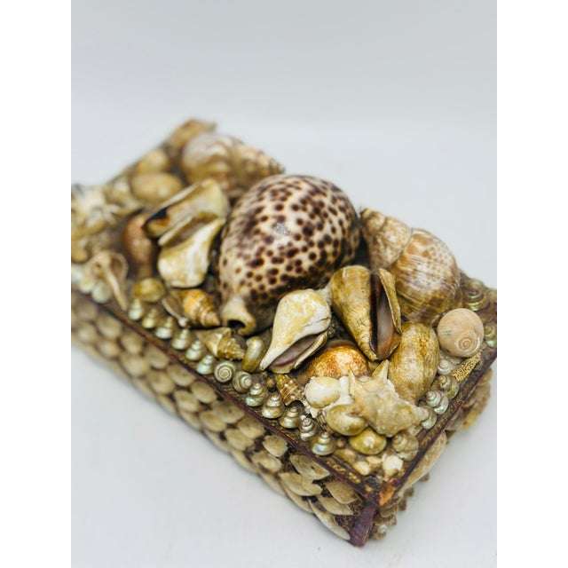 This beautiful box is very old and carefully crafted by hand. With little compartments, it’s perfect for a jewelry box!