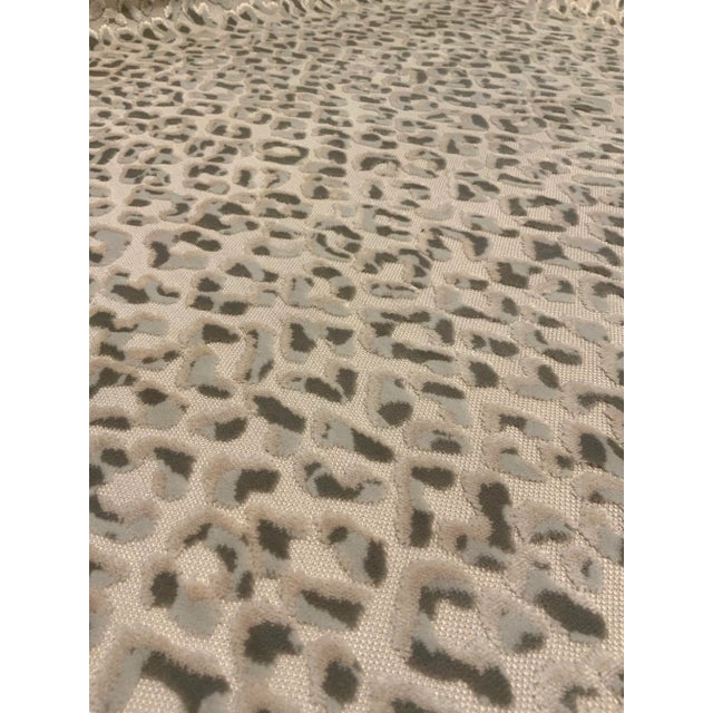 This luxurious modern fabric has a gray and taupe leopard print over a cream woven base cloth. The hand is soft and rich....
