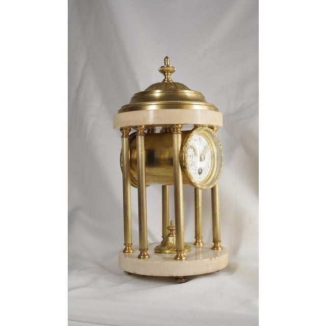 Very rare due to the small size of the clock. Small Antique French boudoir clock in the form of a rotunda 19th century...
