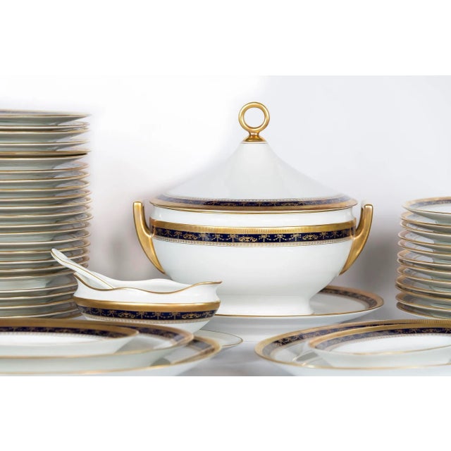 The porcelain set for 12 persons is decorated with cobalt blue/gold decor handmade by Italian porcelain factory Richard...