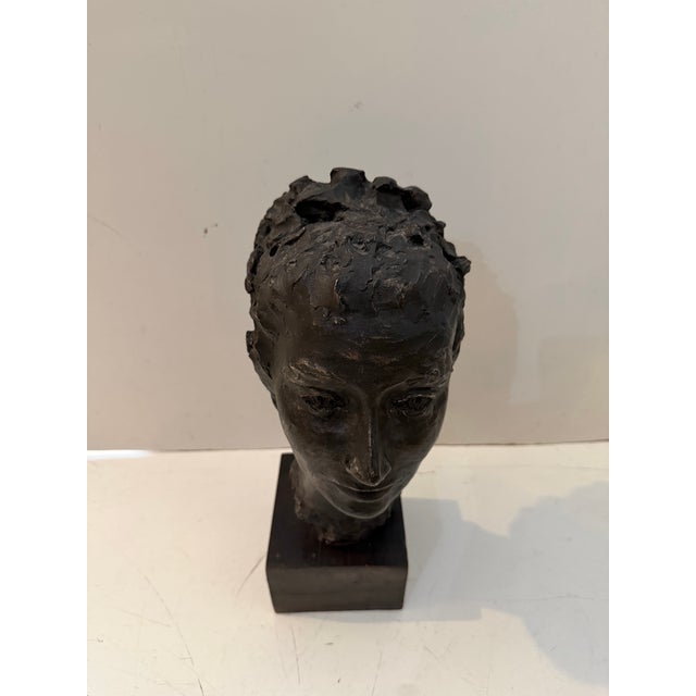 Vintage modern sculptural female bust featuring an expressive, hand-formed look and a rich dark patinated finish. This...