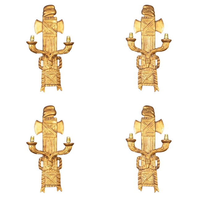 This suite of four wall sconces, crafted in the 19th century, showcases an exquisite blend of molded, carved, and gilded...