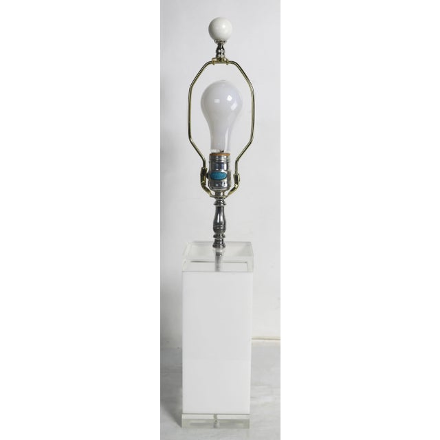 Chic Post Modern Hollywood Regency table lamp of clear and white lucite, by George Bullio, circa 1960's.