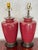Pair of oxblood red glazed ceramic table lamps. The glaze is a deep red with a subtle dark speckle, in the spirit of...