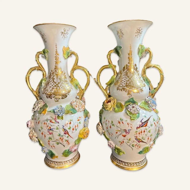 Pair of mid 19th century Rockingham porcelain vases with applied floral decoration, hand painted vignettes and gilt...