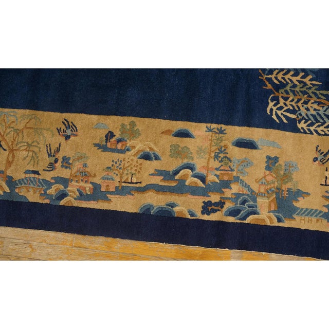 Antique Peking Room Size Wool Blue Navy, Camel Rug, Circa Date: 1920s. This exceptional Chinese textile, presented in a...