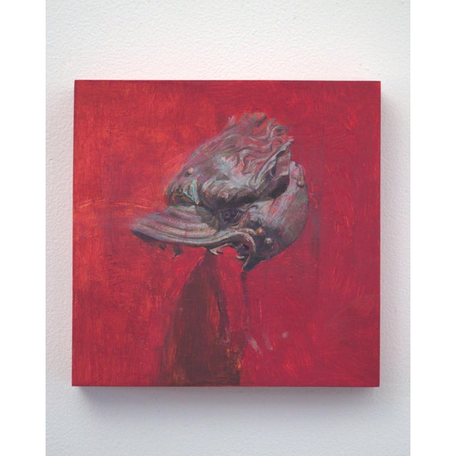The artwork features a striking depiction of a stylized animal head, rendered in rich, vibrant hues against a deep red...
