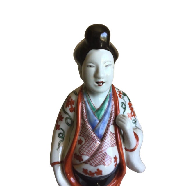 A great vintage Asian male handcrafted hand painted glossy porcelain figurine. Please see pictures for condition. Measures...