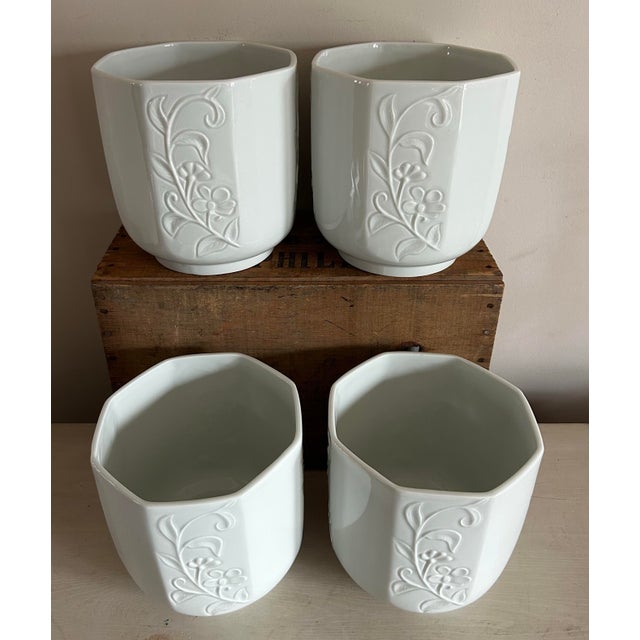 Set of four (4) glazed white pottery octagonal planters made in France by Limoges. New old stock, never used. Features an...