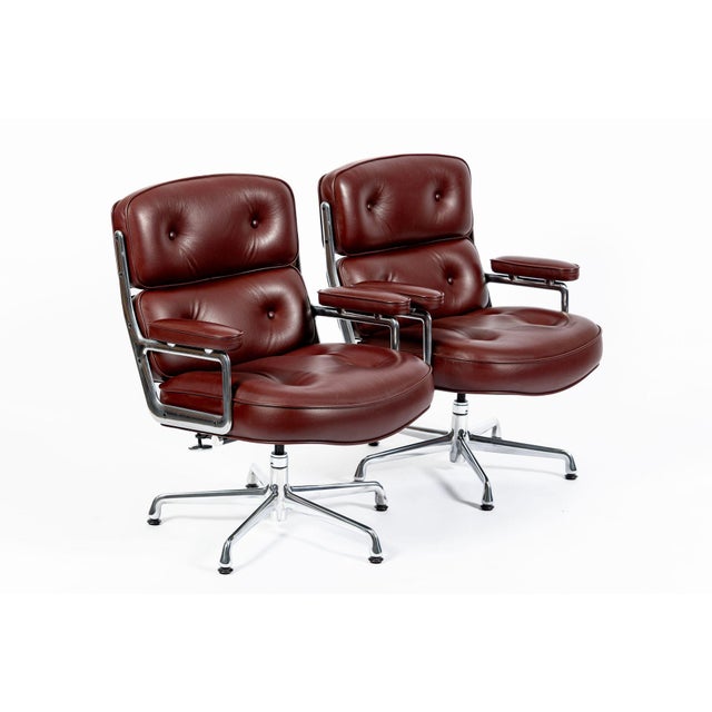 This pair of red Model 3475 Eames Time Life Executive Lobby Chairs designed by Charles & Ray Eames for Herman Miller were...