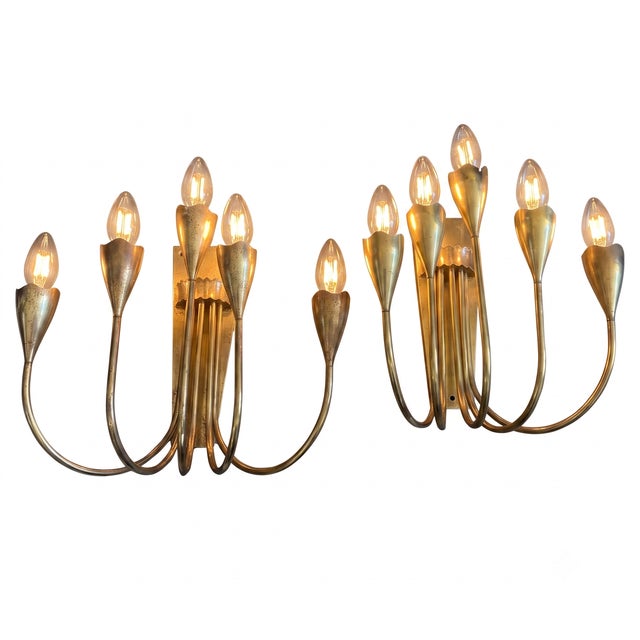 These exquisite wall sconces, dating from the 1940s, capture the refined elegance and sculptural fluidity characteristic...