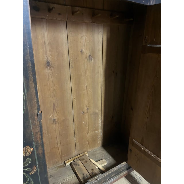 Intricately Hand Painted Exterior of Decorative Floral Motif. Predominate color: Black, with Orange and Gold. Single door....