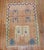 Mid 20th century anatolian rug with a obscure design. Look at the 2 hands on the 1 end