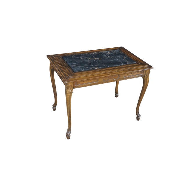 This French Provincial Louis XV style side table features a rectangular silhouette highlighted by a striking, inset black...