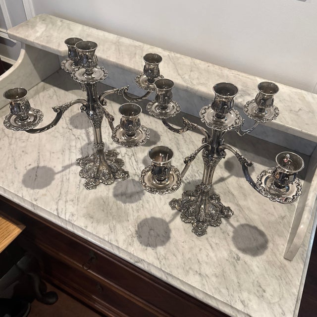 A Pair of large Vintage Rococo-baroque style silver plated 5 arm candelabras. Elaborate scrolling arms, floral embossed...