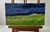 The Oil painting Cardboard titled ""Evening field"" conveys the dramatic beauty and tension of nature as daylight fades...