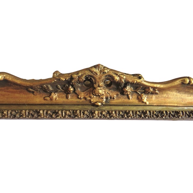 FREE SHIPPING ANYWHERE IN THE CONTINENTAL US! This is an ornate antique picture frame. Late 19th century. Dark gilt wood...